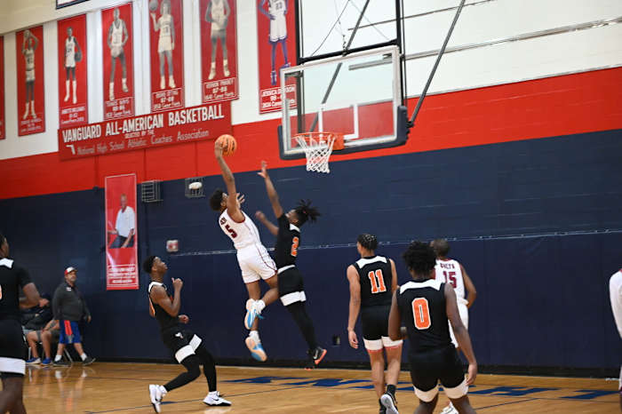 North Marion junior guard Brenden Barber goes in for the slam dunk in a Challenge Round game against Hawthorne on Saturday at the Kingdom in the Sun Tournament at Vanguard High School in Ocala.